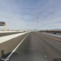 Car changing flat tire in construction lane