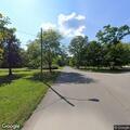 Man walks shirtless and lies down in road in Concord