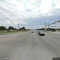 Person walking in roadway near Marketplace and 1626