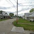 Three people seen searching trash on property