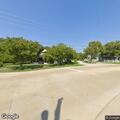 Person sitting on train tracks near 2nd St in Haslet