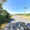 Person receiving CPR near County Road