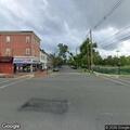 male found on ground next to wheelchair at street corner
