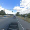 Man knocking on cars and asking for money