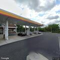Person panhandling outside Shell gas station