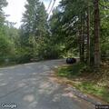 Naked person yelling in yard in North Bend