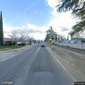 Person with back pain at 45th St E and Wrightwood Way
