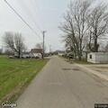 Fallen tree blocks West Versailles Street in Holton