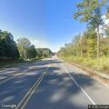Crash damages traffic sign on Burlington Mills Road