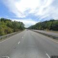Gold SUV reversing in Route 128 breakdown lane