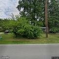 Person walking up to doors on Edmondson Avenue