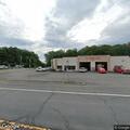 Person slumped over steering wheel in a minivan