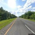 Vehicle stopped with hazard lights on I-95