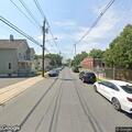 Trash can fire outside AutoZone in Somerville