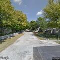Fallen tree damages house and vehicles on Walnut Street