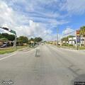 Group of cars drag racing at Opa-locka intersection