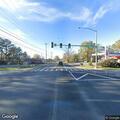 Woman walking in roadway near South Pine and Lincoln