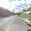 Suspicious man with clothes scattered on street