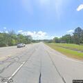 Bus knocks down power lines onto highway 64
