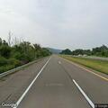 Disabled car with flat tire on I-86 near Savona