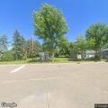 Three people stealing railroad ties near Front Street