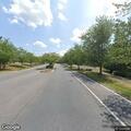 Suspicious vehicle with man making rude gestures