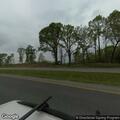 Man sitting in highway median near construction zone