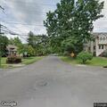 Illegal wood fire in yard at corner house