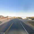 Car speeding with lights flashing on Highway 40