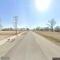Person walking in roadway on State Highway D