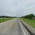 Slow vehicle driving on highway shoulder