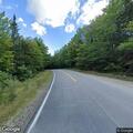 Tree on fire near Sawyer Highway and Elbow Pond Road
