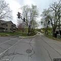 Male lying awake at street intersection in Lemont