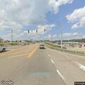 Officer checks on woman walking near highway ramp