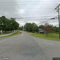 Officer with disabled vehicle blocking intersection