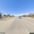 Vehicle hit deer and animal trapped under truck