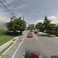 Auto accident with spill at village intersection