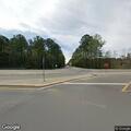 Person seeking help next to parked white minivan on SC 9