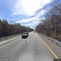 Pedestrian walking on I-75 shoulder near rest area