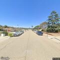Car driving in circles and honking in neighborhood
