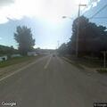 Unoccupied truck and trailer blocking roadway