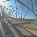 Fire crews extinguish smoldering racks on bridge