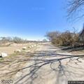 18-wheeler stuck under train bridge on County Road