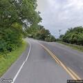 Woman yelling and walking in roadway in Nedrow