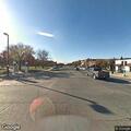 Officer checks silver Chevy Silverado on Kansas Ave