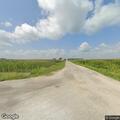Brush fire near abandoned house on East 800 Avenue