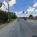 Officer stops blue Ford Mustang at intersection