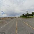 Reckless red sedan towing trailer on Highway 93