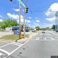 Car crash injures person and damages street light pole