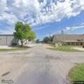 Fallen tree blocks road to school in Apache